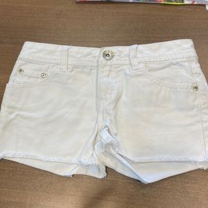 White size 10 regular Justice brand cut off jean shorts. Great condition.